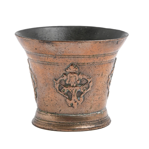 269 - An English decorated bronze mortar, Norwich, late 16th c, cast with the head of Christ within scroll... 