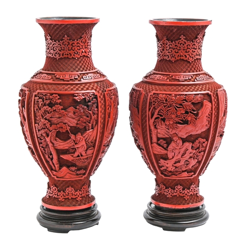 271 - A pair of Chinese cinnabar lacquer vases, c1900, carved with four panels of immortals and other figu... 