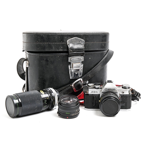 295 - A Canon AE-1 35mm single lens reflex camera and maker's 50mm F1.8 and 28mm F2.8 lenses and another l... 