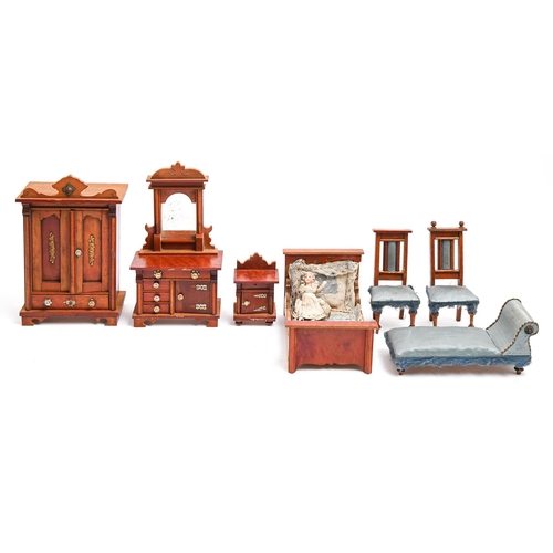 307 - A suite of German stained softwood doll's house furniture, late 19th c, comprising wardrobe, bed, dr... 