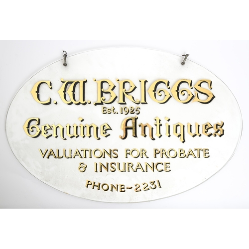 327 - Advertising. A plate glass oval shop window hanging trade sign, second quarter 20th c, lettered in b... 