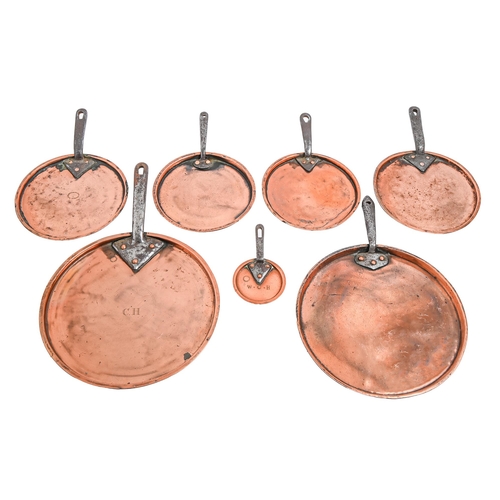 350 - Seven graduated Victorian copper pan lids, with iron handle, two initialled CH or WCH, one by Jones ... 