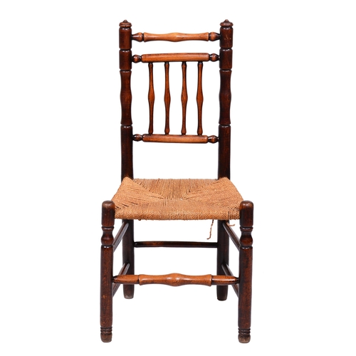 382 - A fruitwood and ash spindle back chair, early 19th c, rush seat, 44cm hThe collection of C. W. Brigg... 