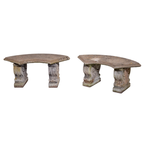 385 - A pair of reconstituted stone garden benches, the quarter circular slab on volute blocks, 38cm h, 96... 