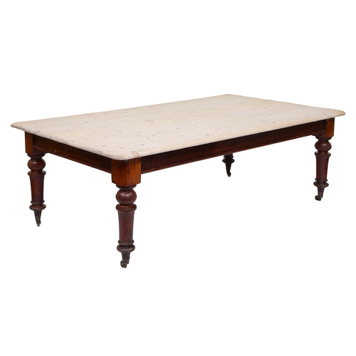 387 - A Victorian servant's hall or kitchen table, the pine top on mahogany base with pottery castors, 74c... 