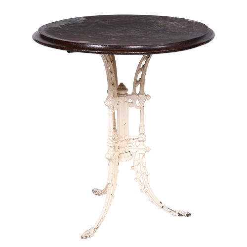 416 - A Victorian cast iron pub table, the round wood top on three decorative incurved legs around central... 