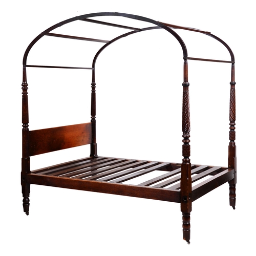 427 - A mahogany four poster bed, early 19th c,  the turned foreposts spirally fluted and with turned back... 