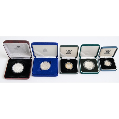 607 - Three various United Kingdom proof silver commemorative crowns, each cased with certificate, proof s... 