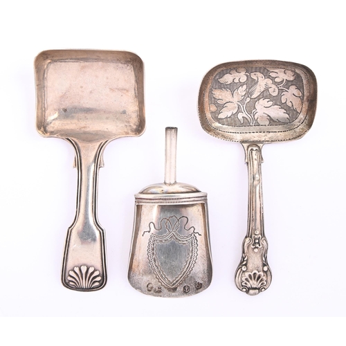 89 - Three silver caddy spoons, comprising a shovel engraved with shield cartouche, lacks handle, 58mm l,... 