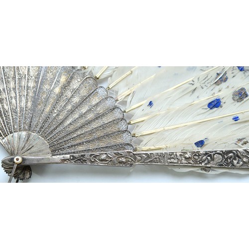 111 - A Chinese export silver and feather fan, 19th c, with filigree guards and repousse sticks, mother of... 