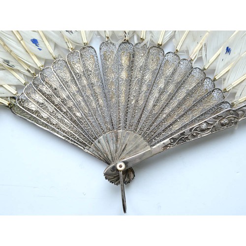 111 - A Chinese export silver and feather fan, 19th c, with filigree guards and repousse sticks, mother of... 