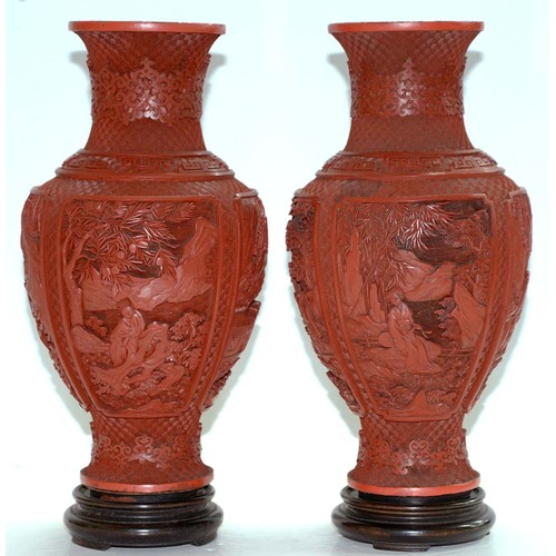 271 - A pair of Chinese cinnabar lacquer vases, c1900, carved with four panels of immortals and other figu... 