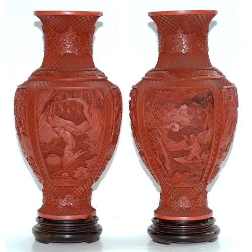 271 - A pair of Chinese cinnabar lacquer vases, c1900, carved with four panels of immortals and other figu... 