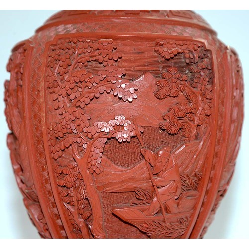 271 - A pair of Chinese cinnabar lacquer vases, c1900, carved with four panels of immortals and other figu... 