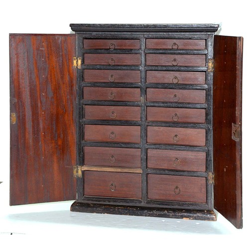 301 - A mahogany and ebony collector's cabinet, 19th c, fitted with sixteen drawers with brass wire ring p... 