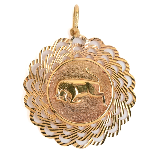 110 - A pierced gold leaping bull pendant, 38mm diam, marked 750, 4.4g