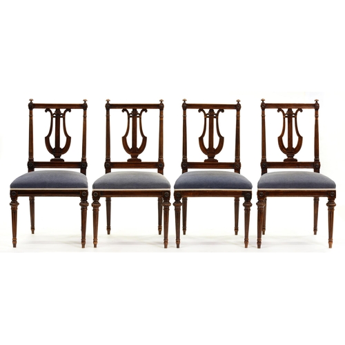 1380 - A set of four Danish neo classical stained wood chairs, early 19th c, the rectangular back with lyre... 