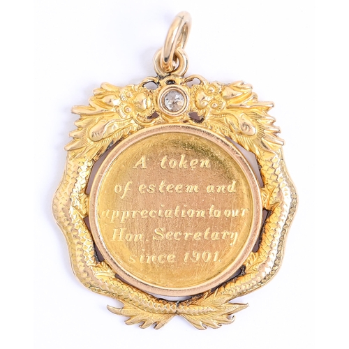18 - A Chinese gold pendant, c1900, set with an old cut diamond and engraved A token of our esteem and ap... 