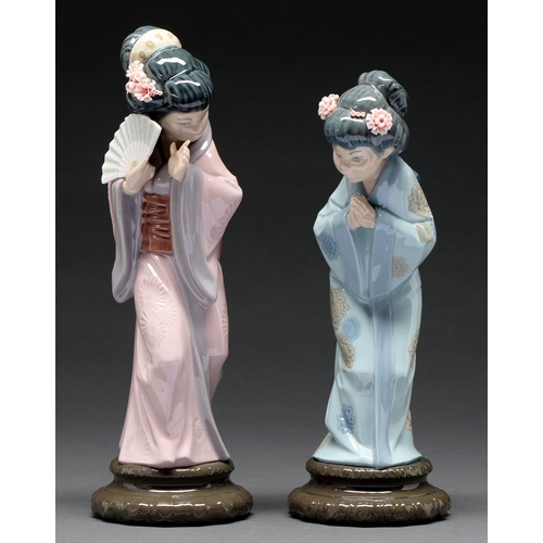 558 - A pair of Lladro figures of Japanese women, 27 and 30cm h, printed mark