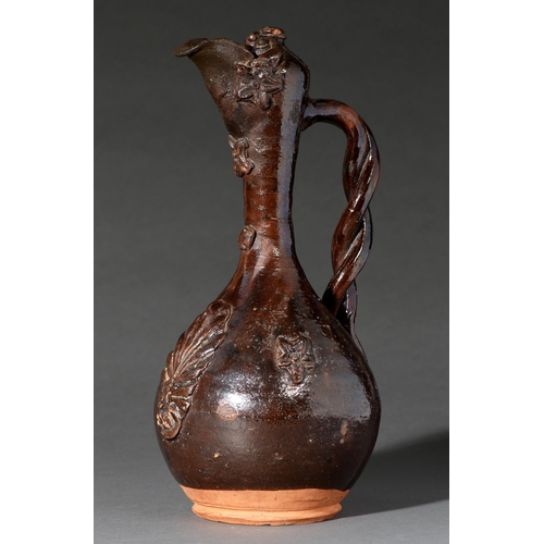 561 - Ottoman ceramics. A Canakkale glazed terracotta ewer, late 19th c, with typical sprigged decoration ... 