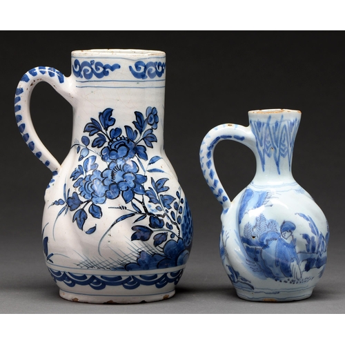 572 - A German spirally lobed faience jug and a similar smaller Delft Ware jug, probably Dutch, both 18th ... 
