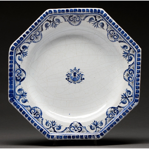 591 - A French octagonal faience dish, possibly Moustiers, 18th c, painted in cobalt with a central floral... 
