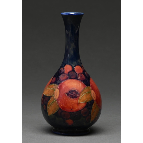 605 - A Moorcroft Pomegranate vase, c1920, 21.5cm h, impressed marks, blue painted initials... 