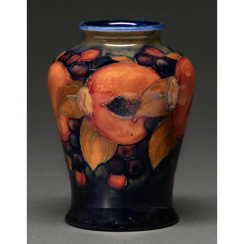 609 - A Moorcroft Pomegranate vase, c1915-20, 13cm h, impressed marks, green painted signature... 