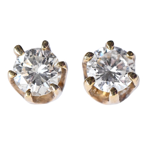 61 - A pair of diamond ear studs, in gold, 4mm diam, marked 18c, 1g