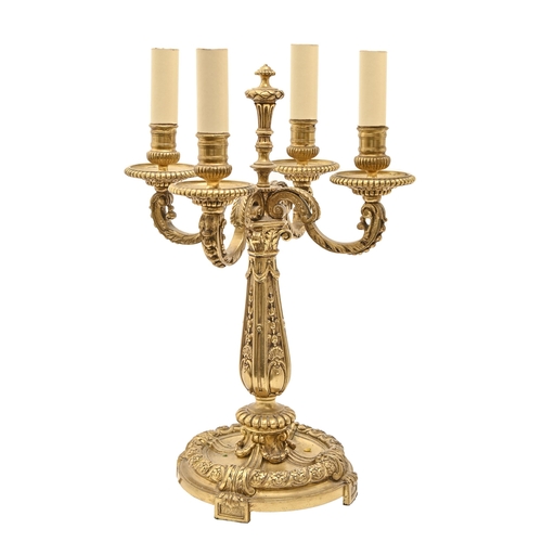 919 - A gilt lacquered brass candelabrum of four lights, in Louis XVI style, 45cm h