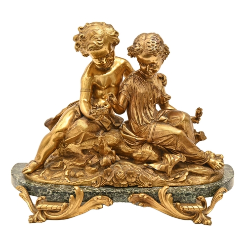 927 - A gilt bronze sculpture of two children with a bird's nest, 19th / 20th c, on green marble breakfron... 