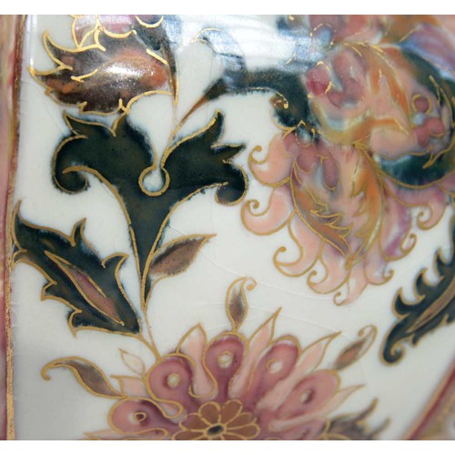 557 - A Zsolnay pierced jardiniere, c1885, decorated with flowers on an old ivory ground between pink and ... 