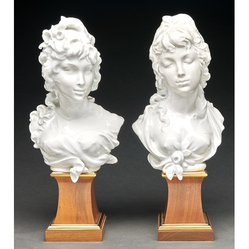 291 - A pair of Royal Worcester glazed porcelain busts of Night and Day designed by Arnold Machin, introdu... 