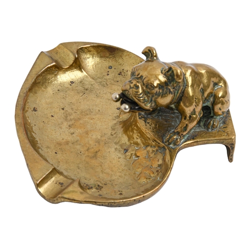 575 - A Victorian cast brass bulldog novelty ashtray,  the dog's mouth containing a retractable cigar... 