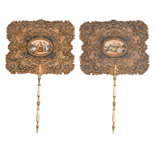 577 - A pair of early Victorian polychrome cloth faced hand screens,  inset with varnished prints of child... 