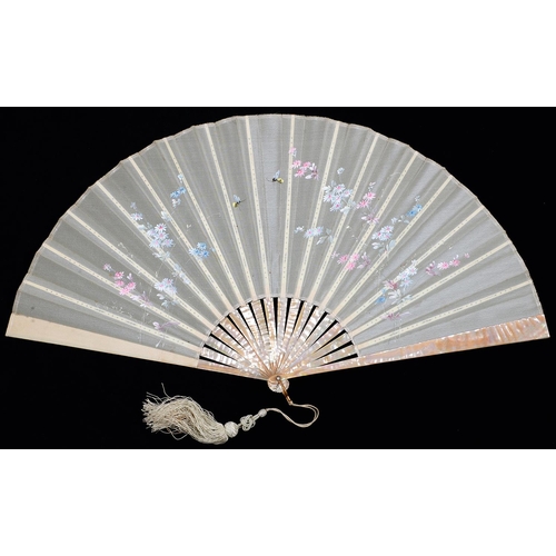 579 - Two French mother of pearl fans, c1900, the silk or gauze leaf painted with flowers, one signed with... 