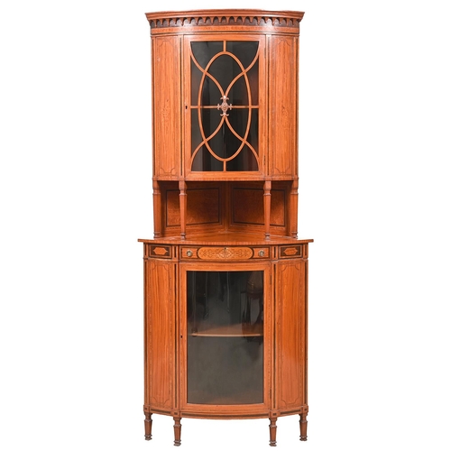 1043 - An Edwardian bow fronted satinwood and inlaid standing corner cabinet, with pear drop cornice and og... 