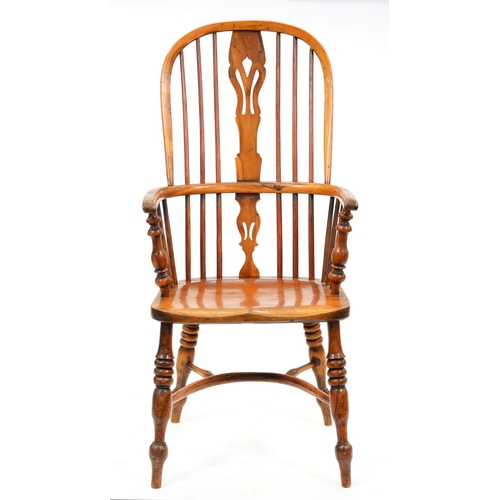 1031 - A Victorian yew wood high back Windsor chair, with crinoline stretcher and elm seat, traces of red s... 