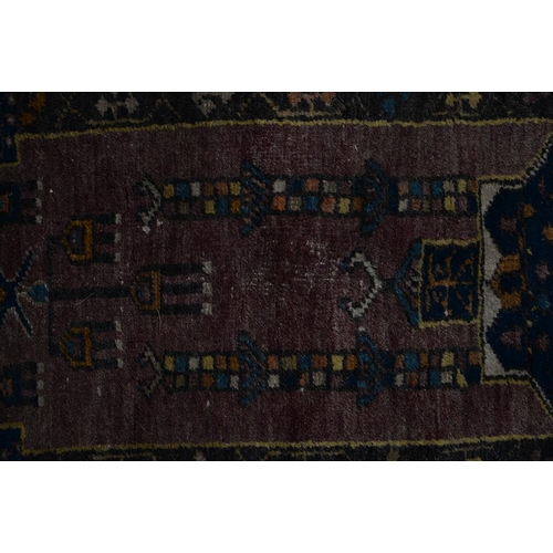 1052 - An antique rug, 112 x 210cm and two other, smaller rugs (3)