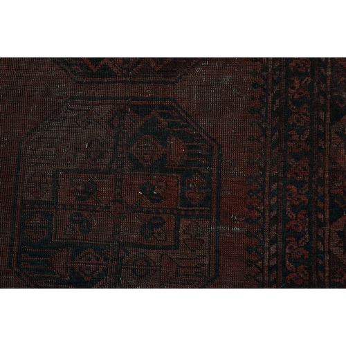 1052 - An antique rug, 112 x 210cm and two other, smaller rugs (3)