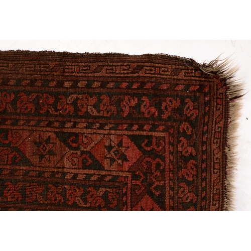 1052 - An antique rug, 112 x 210cm and two other, smaller rugs (3)