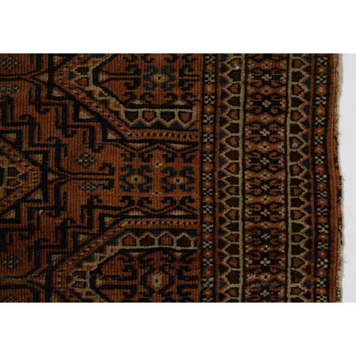 1052 - An antique rug, 112 x 210cm and two other, smaller rugs (3)