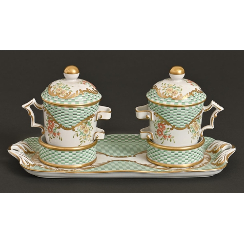 153 - A pair of French porcelain cups and covers on socketed tray, 20th c, decorated in 18th c style on a ... 