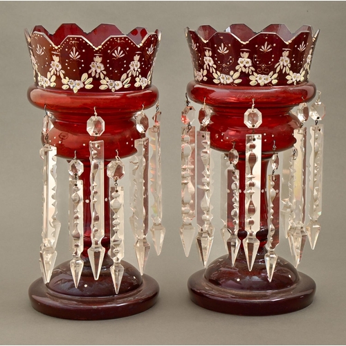 221 - A pair of enamelled red glass lustres, late 19th century, hung with prismatic cut clear glass beads ... 