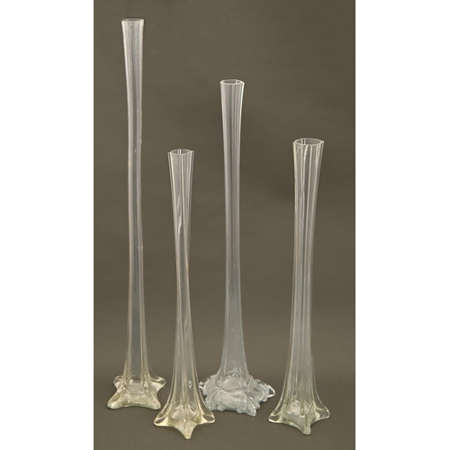 226 - Four similar glass lily vases, 20th c, 49.5 - 70.5cm h