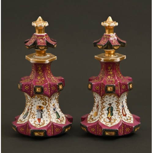 263 - A pair of French porcelain claret ground scent bottles and stoppers, c1840, painted with individual ... 