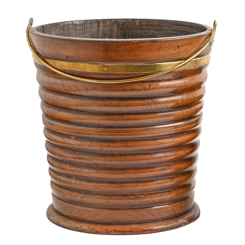 451 - A Dutch brass bound and turned walnut bucket, 19th c,  with brass handle and a sheet brass line... 