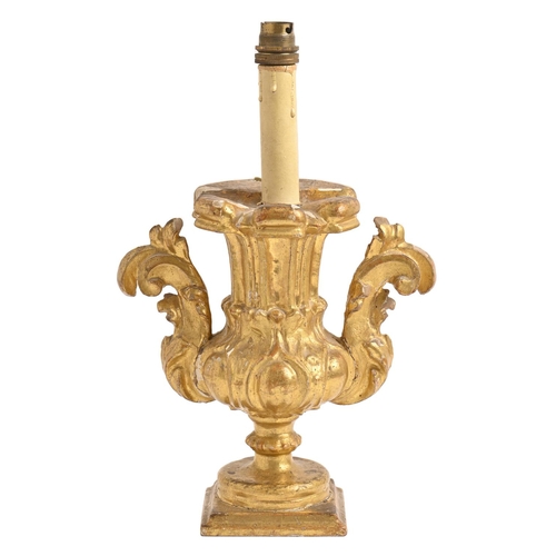 453 - An Italian giltwood vase shaped candlestick, 19th c, adapted as a lamp, 26cm h excluding fitmen... 