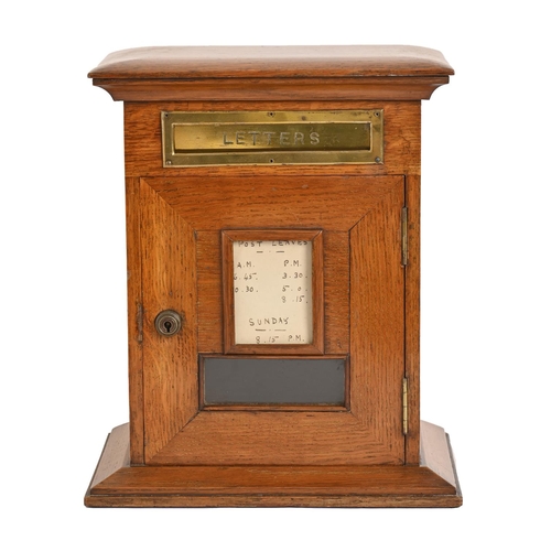 492 - A Victorian oak domestic posting box, c1900, of pillar shape with brass letter slot, fenestrated doo... 