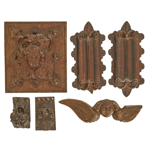 520 - A Baroque oak architectural panel, late 17th/early 18th c, carved and centered by a putto mask ... 